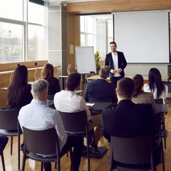 A picture of a business man speaking at a conference