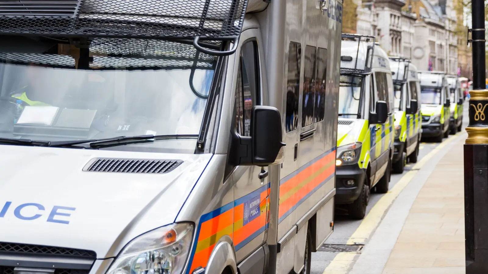 Police Vans Parked by the Side of the Road