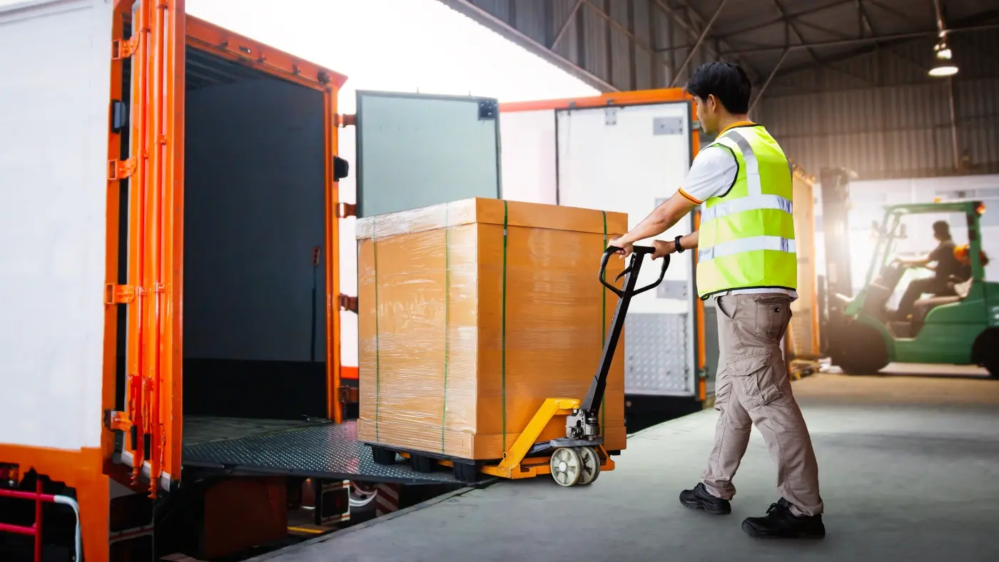 man loading the trailer in at the loading deck