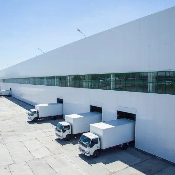 loading bay of a logistics facility with loading trucks