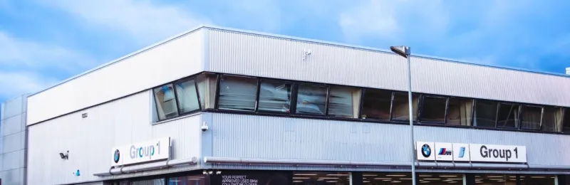 BMW dealership exterior at Stansted with parked vehicles