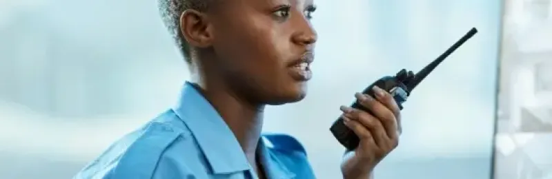 Security personnel at a desk