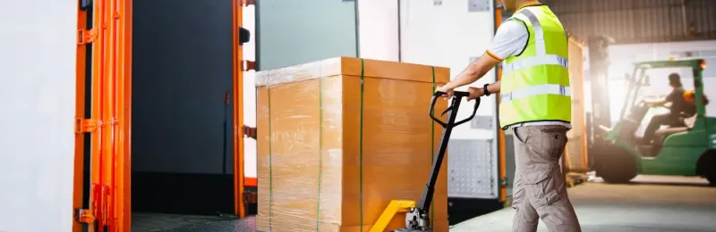 man loading the trailer in at the loading deck