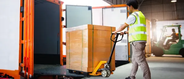 man loading the trailer in at the loading deck