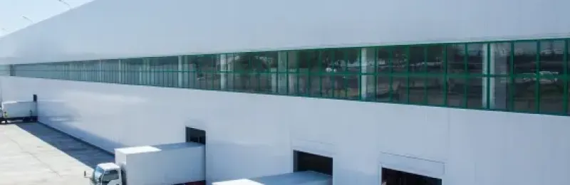 loading bay of a logistics facility with loading trucks